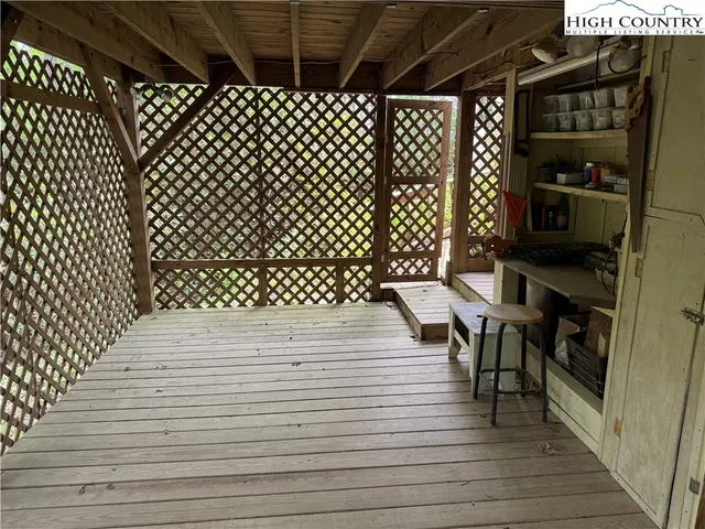 a view of a patio with wooden floor