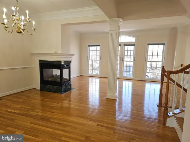 a view of a livingroom with wooden floor