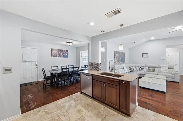 a view of a house with pool and sitting area