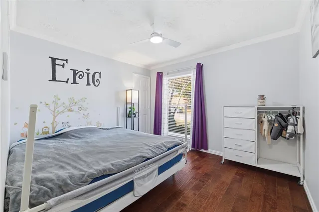 a view of a dining room and livingroom with furniture wooden floor and a rug