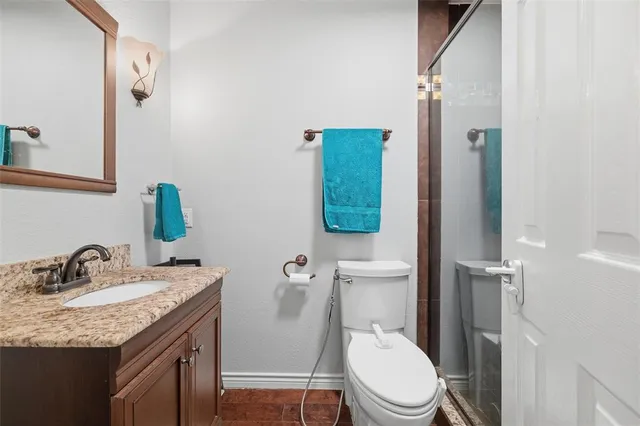 a spacious bedroom with a bed and a dresser