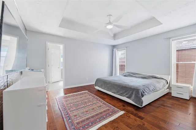 a bedroom with a bed and a book shelf