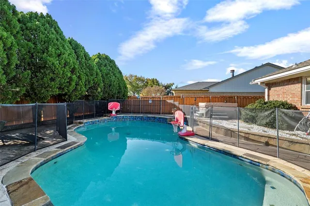 a view of a chairs and table in a patio