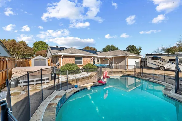 a view of a street with potted plants