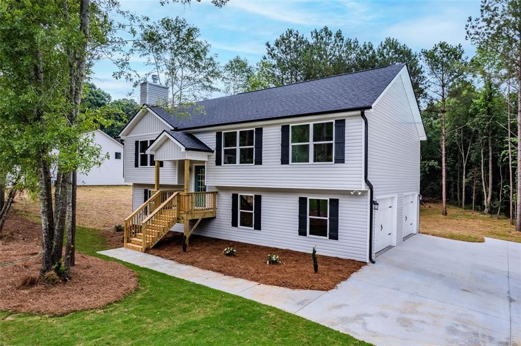 5185 Waterworks Road Jefferson, GA 30549 - Photo 1 of 1 a view of a house with a yard and sitting area
