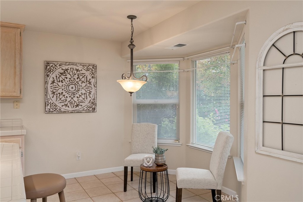 853 Coit Tower Way Chico, CA 95928 - Photo 24 of 49 a view of a dining room with furniture window and outside view