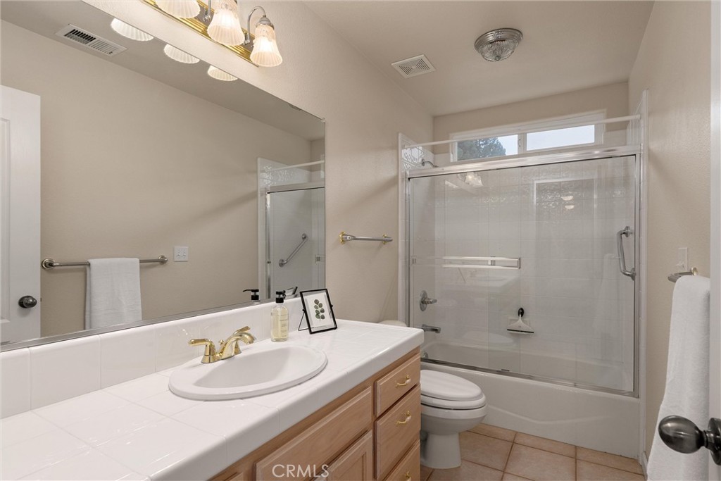 853 Coit Tower Way Chico, CA 95928 - Photo 34 of 49 a bathroom with a sink a toilet and shower