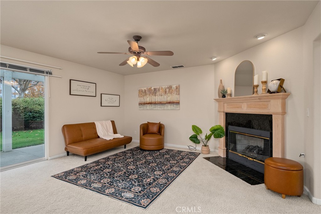 853 Coit Tower Way Chico, CA 95928 - Photo 4 of 49 a living room with furniture and a fireplace
