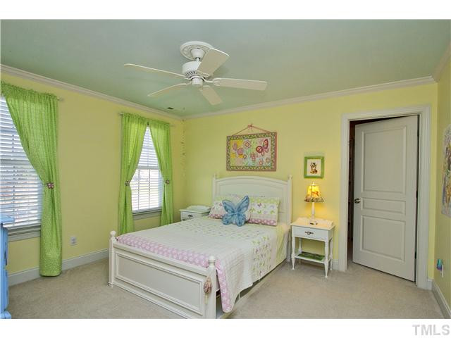 8717 Oregon Inlet Court Raleigh, NC 27603 - Photo 16 of 25 Bedroom with crown moulding and walk-in closet! Bedroom