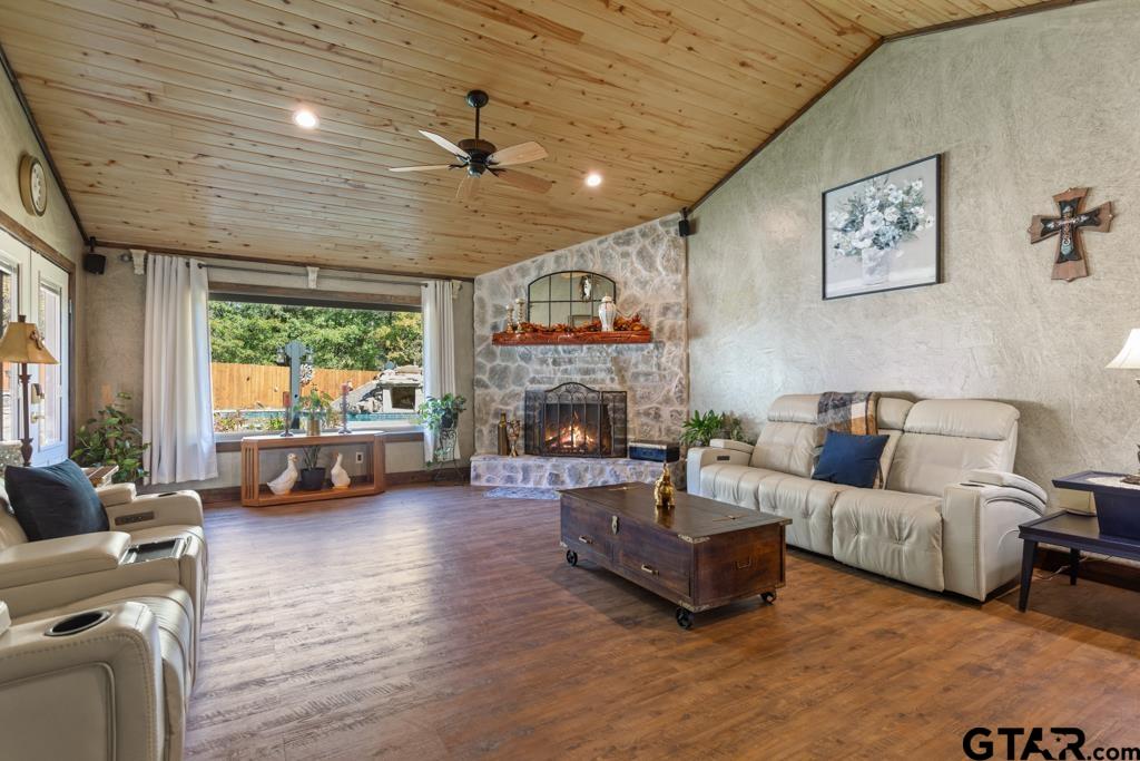 10433 County Road 334 Tyler, TX 75708 - Photo 11 of 43 a living room with furniture large window and a fireplace