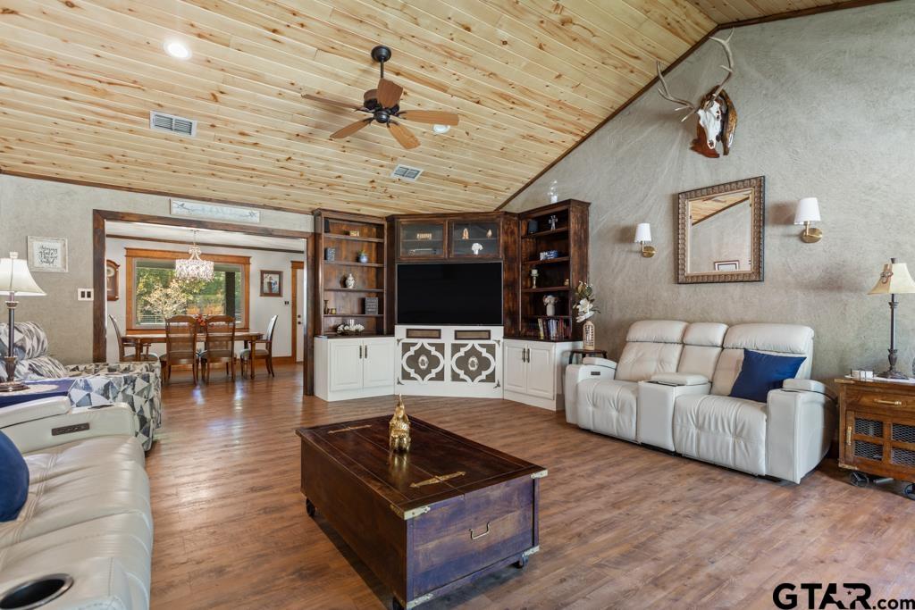 10433 County Road 334 Tyler, TX 75708 - Photo 13 of 43 a living room with furniture and a flat screen tv