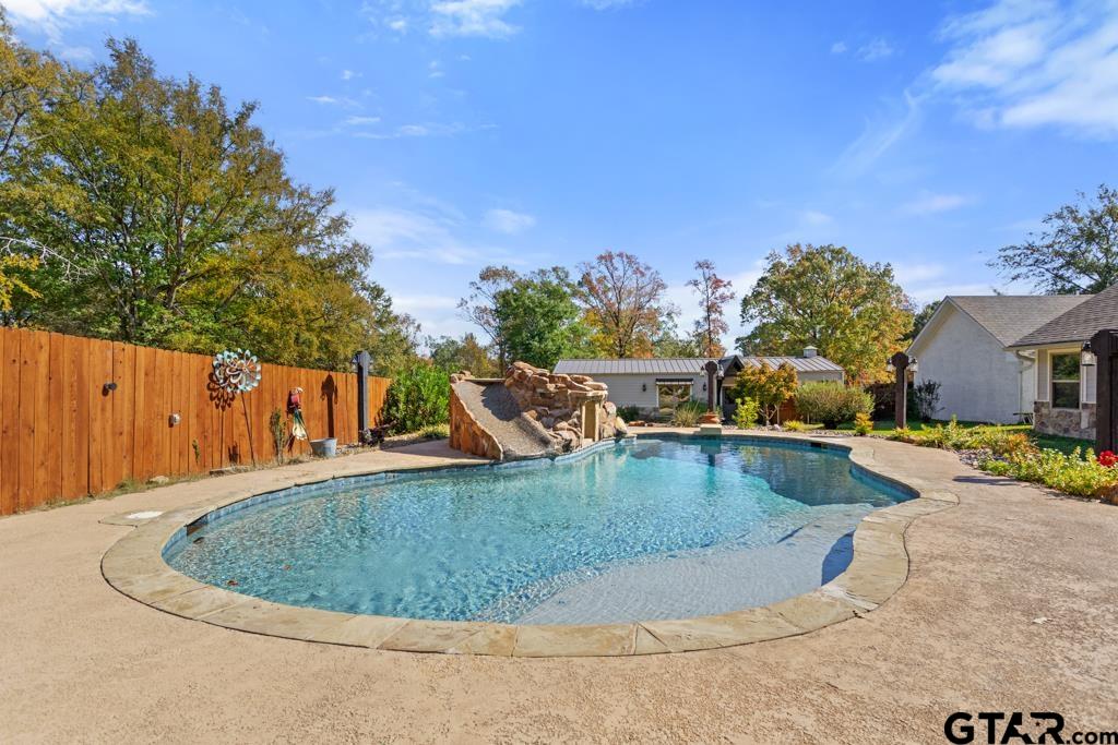 10433 County Road 334 Tyler, TX 75708 - Photo 27 of 43 a view of a swimming pool with a yard