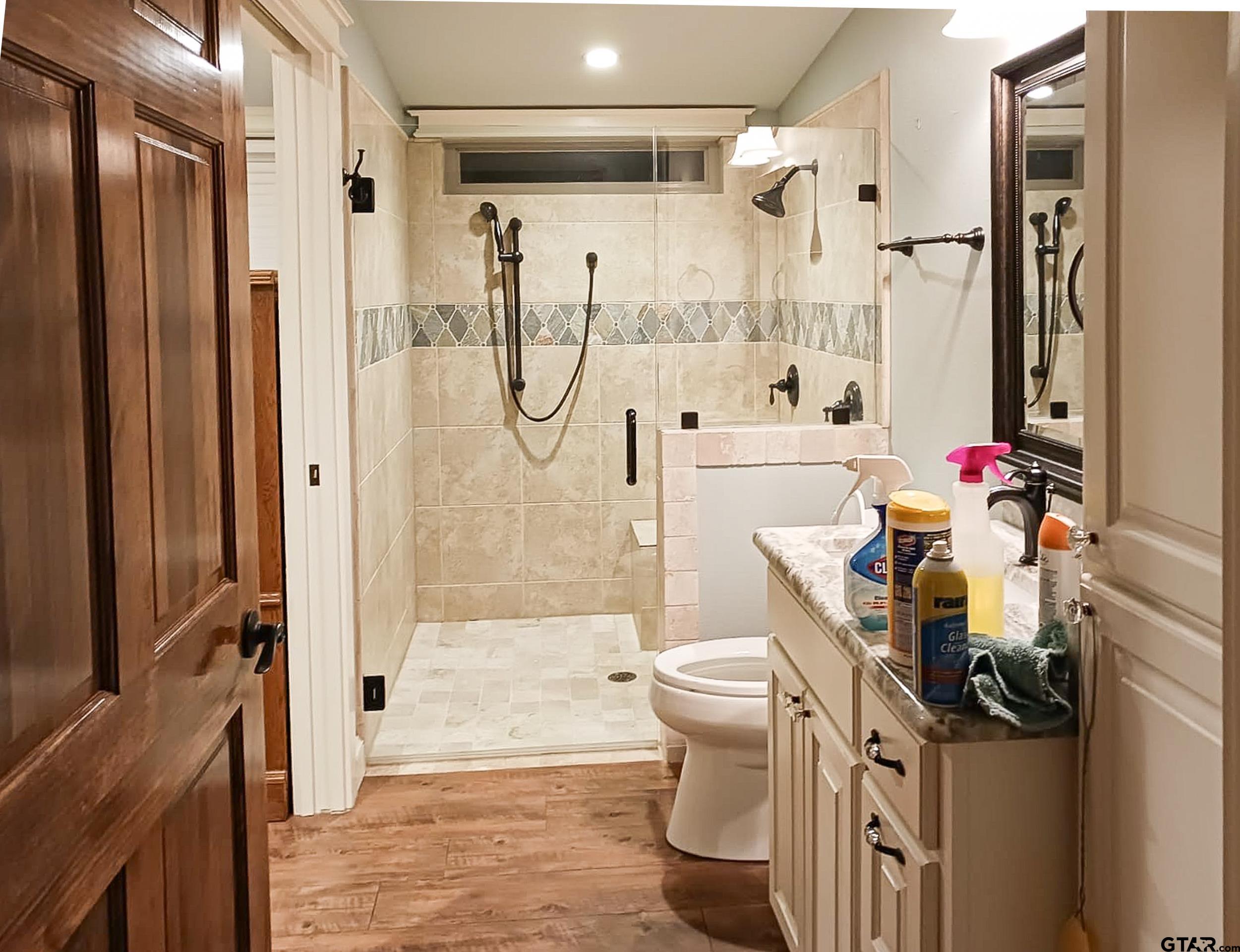 10433 County Road 334 Tyler, TX 75708 - Photo 34 of 43 a bathroom with a bathtub shower sink and toilet
