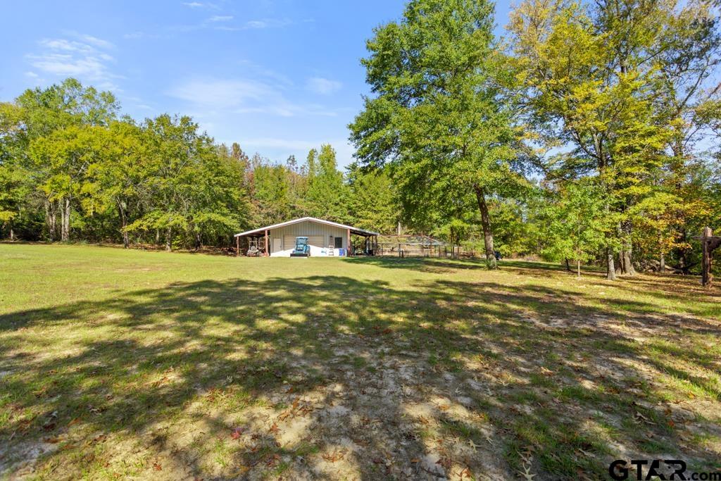 10433 County Road 334 Tyler, TX 75708 - Photo 35 of 43 a view of a house with a yard