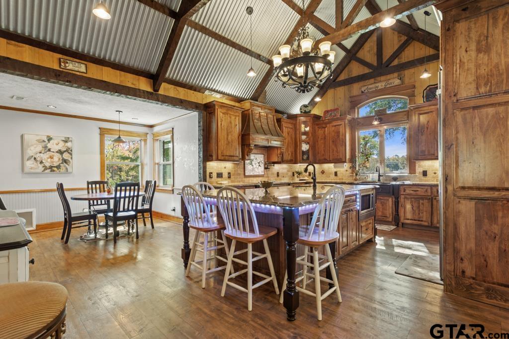 10433 County Road 334 Tyler, TX 75708 - Photo 6 of 43 a view of a dining room with furniture window and wooden floor