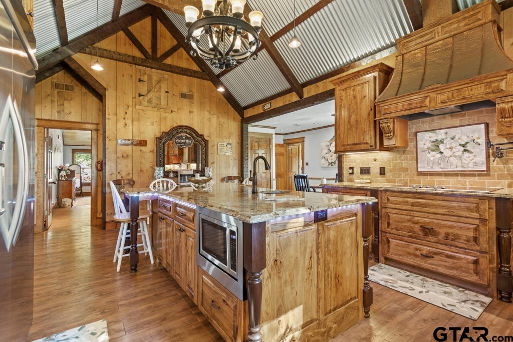 10433 County Road 334 Tyler, TX 75708 - Photo 8 of 43 a kitchen with stainless steel appliances granite countertop a stove and cabinets