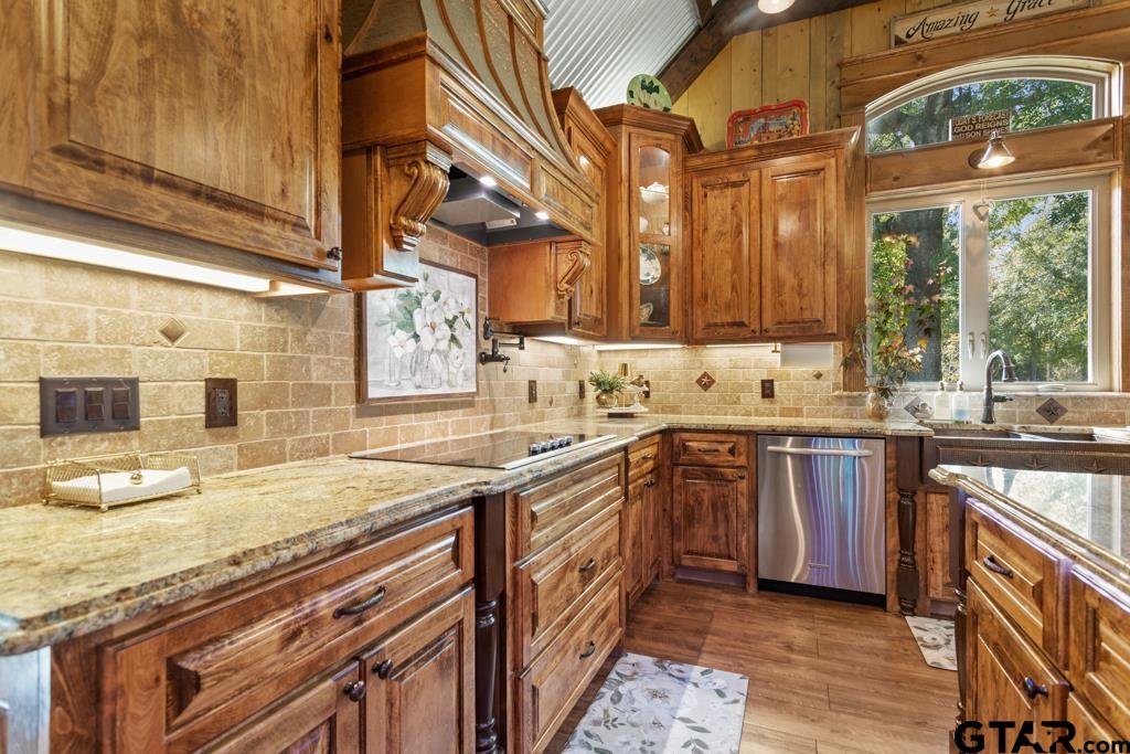 10433 County Road 334 Tyler, TX 75708 - Photo 9 of 43 a kitchen with a sink stove and cabinets