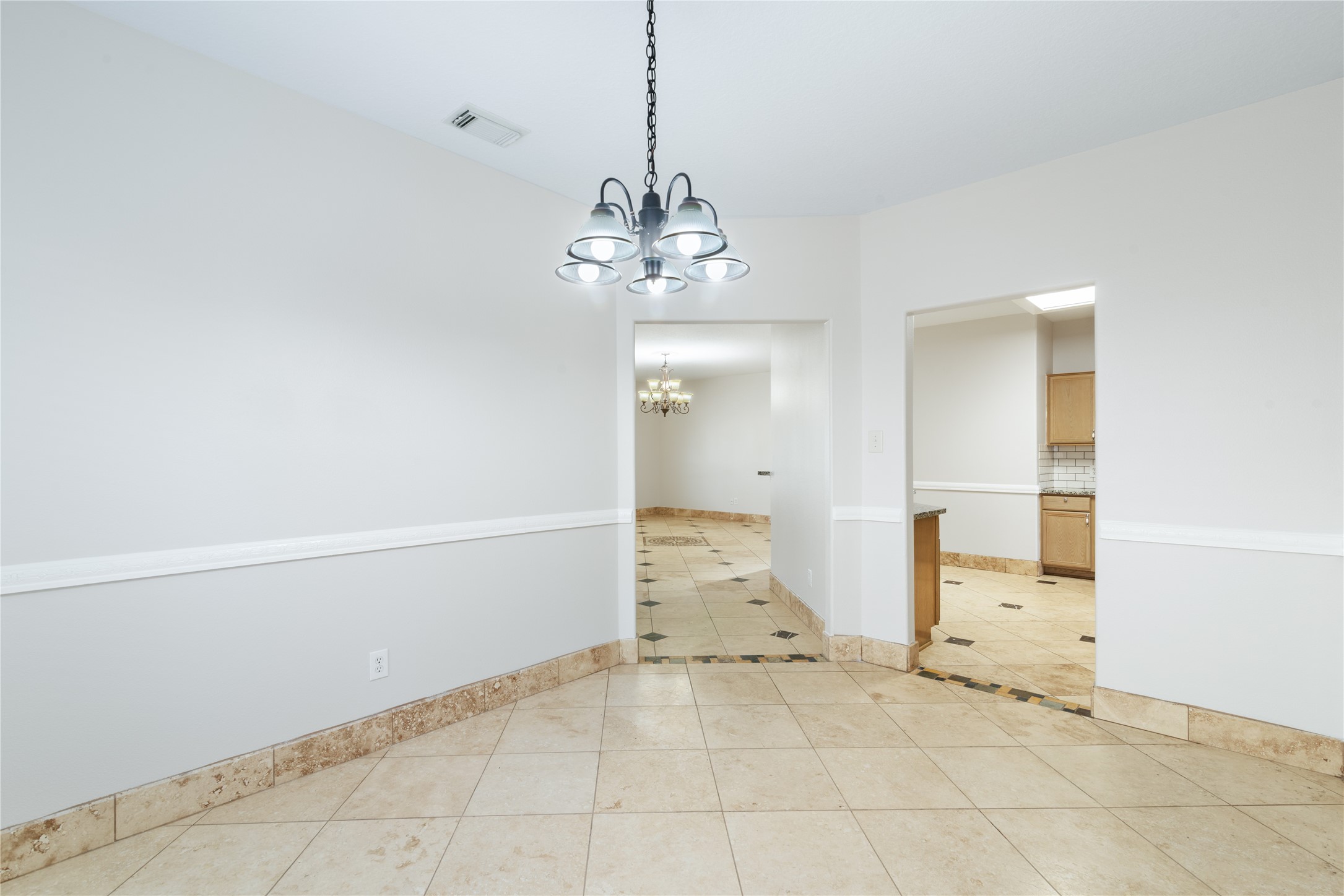 15423 Day Trip Trail Cypress, TX 77429 - Photo 11 of 31 a view of a chandelier in an empty room