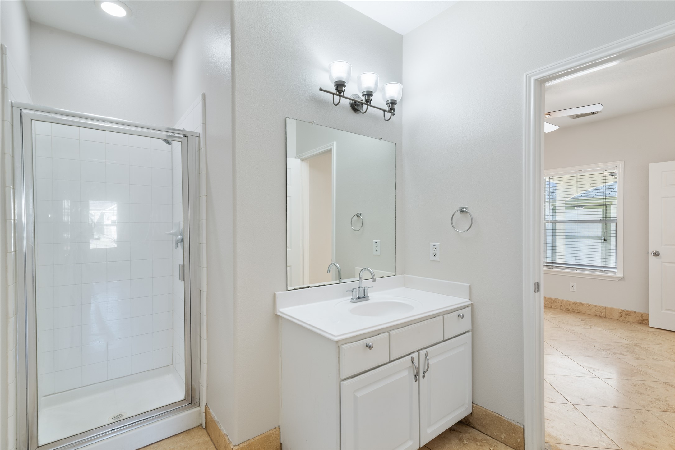 15423 Day Trip Trail Cypress, TX 77429 - Photo 12 of 31 a bathroom with a sink vanity and a mirror