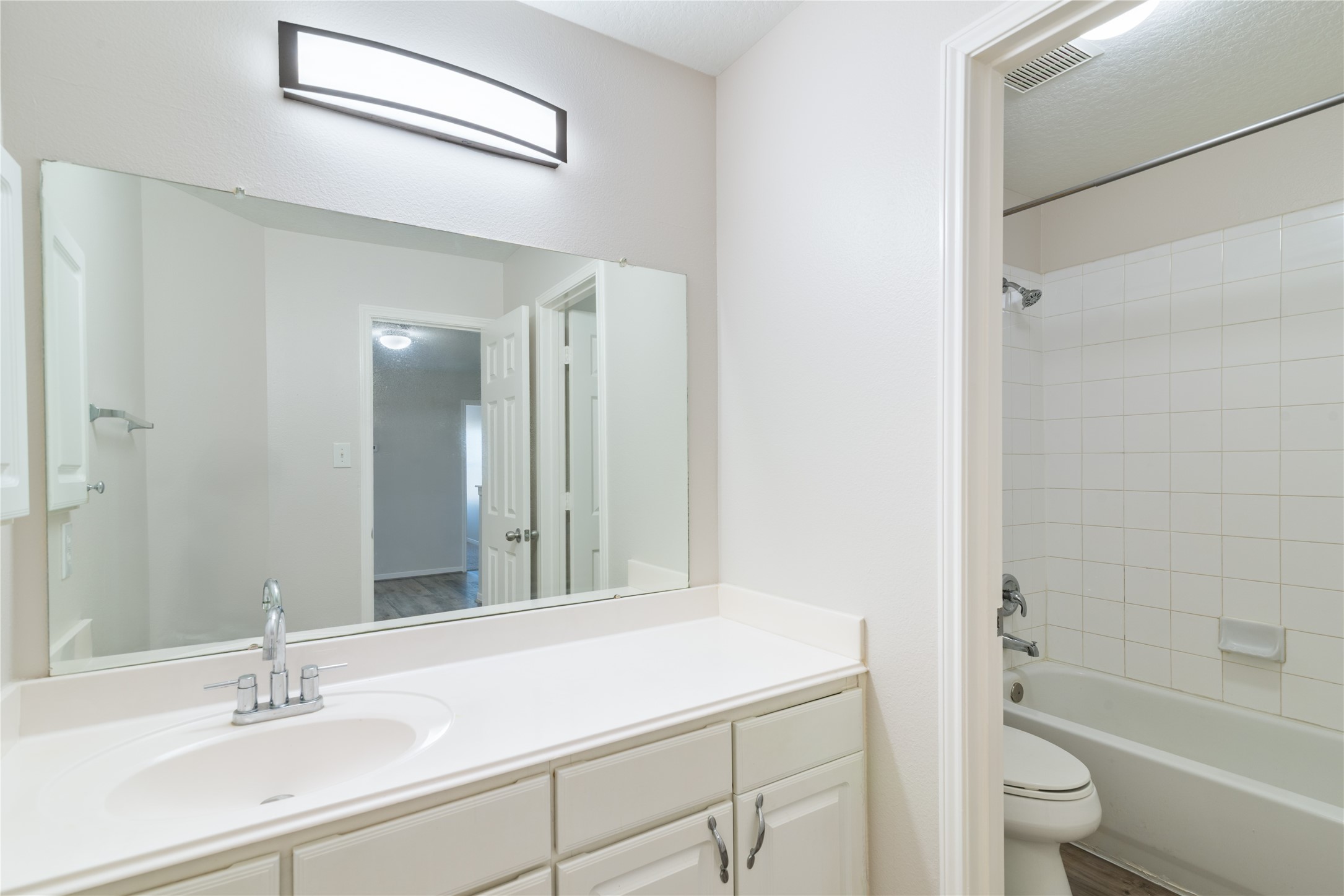 15423 Day Trip Trail Cypress, TX 77429 - Photo 16 of 31 a bathroom with a sink a toilet and shower