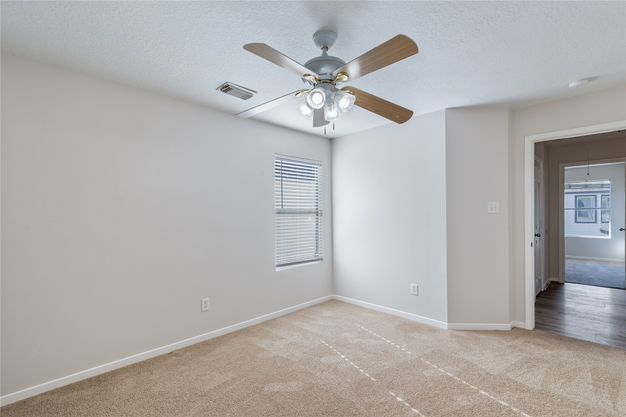 15423 Day Trip Trail Cypress, TX 77429 - Photo 18 of 31 an empty room with windows and fan
