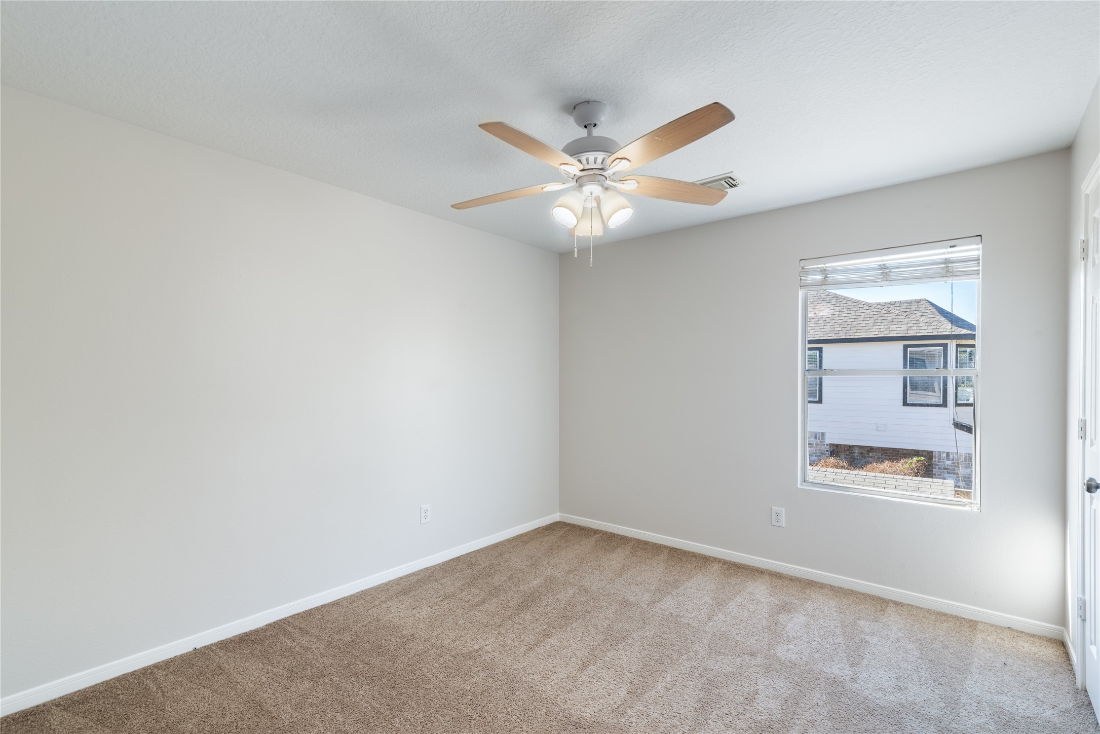 15423 Day Trip Trail Cypress, TX 77429 - Photo 19 of 31 an empty room with windows and fan