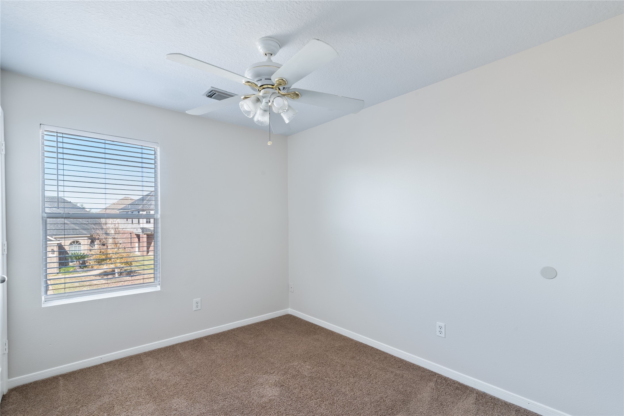 15423 Day Trip Trail Cypress, TX 77429 - Photo 25 of 31 an empty room with windows and fan