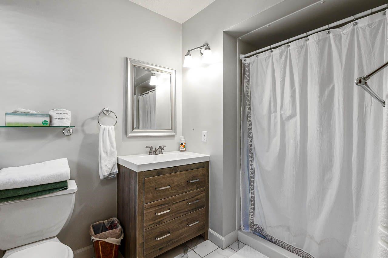 3109 Barnsley Lane Raleigh, NC 27604 - Photo 16 of 50 a bathroom with a toilet a sink and mirror