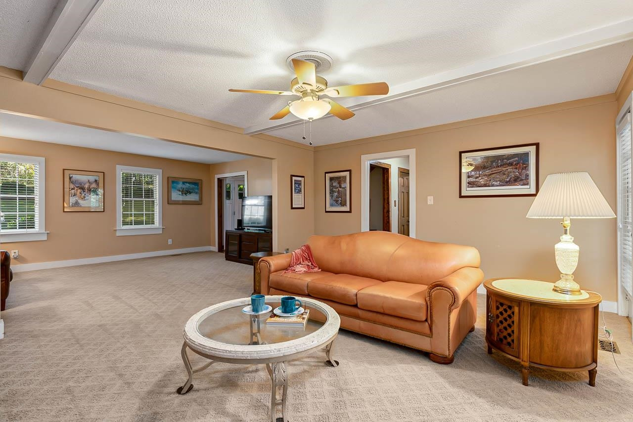3109 Barnsley Lane Raleigh, NC 27604 - Photo 20 of 50 a living room with furniture a window and a lamp