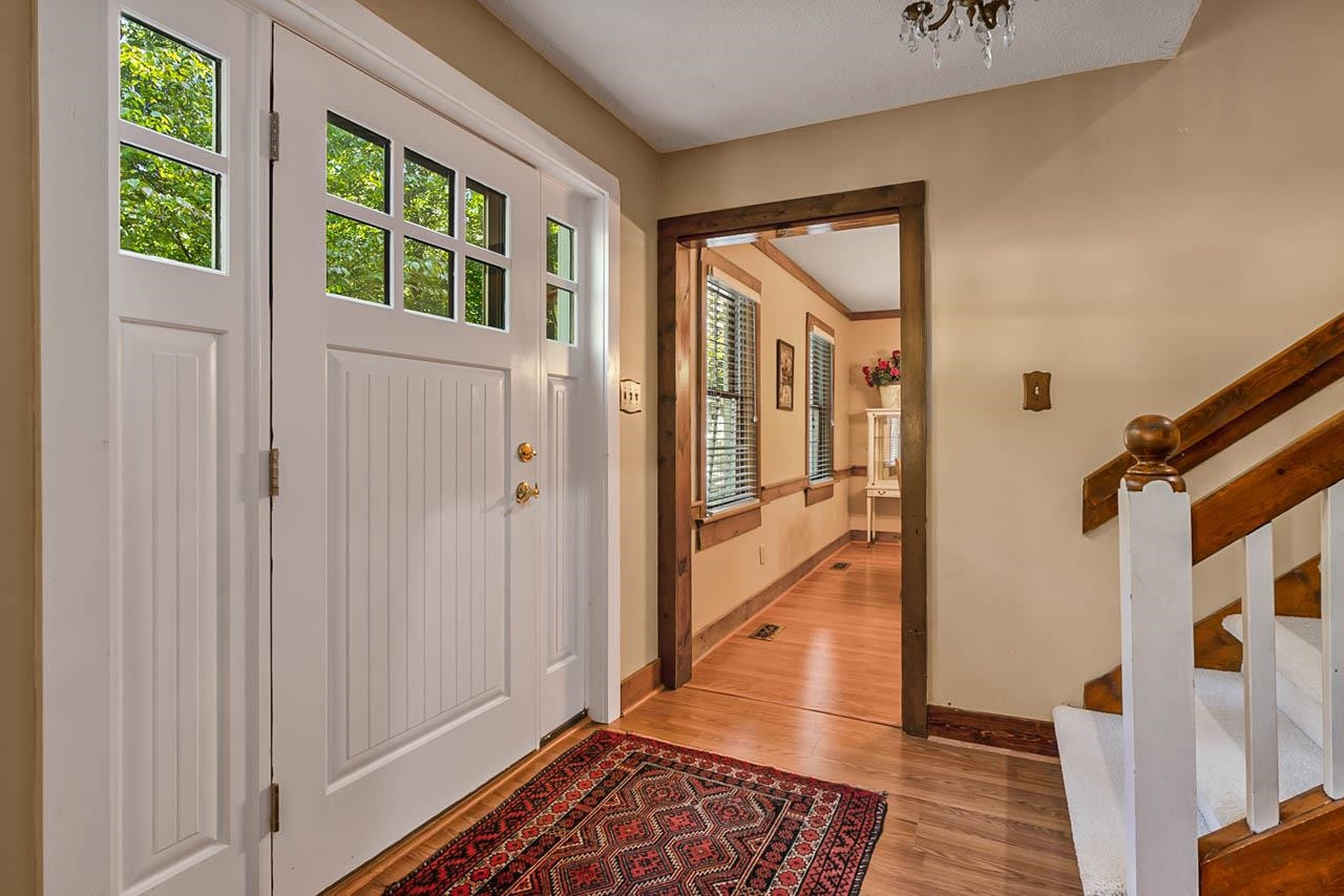 3109 Barnsley Lane Raleigh, NC 27604 - Photo 2 of 50 a view of a hallway with wooden floor and windows