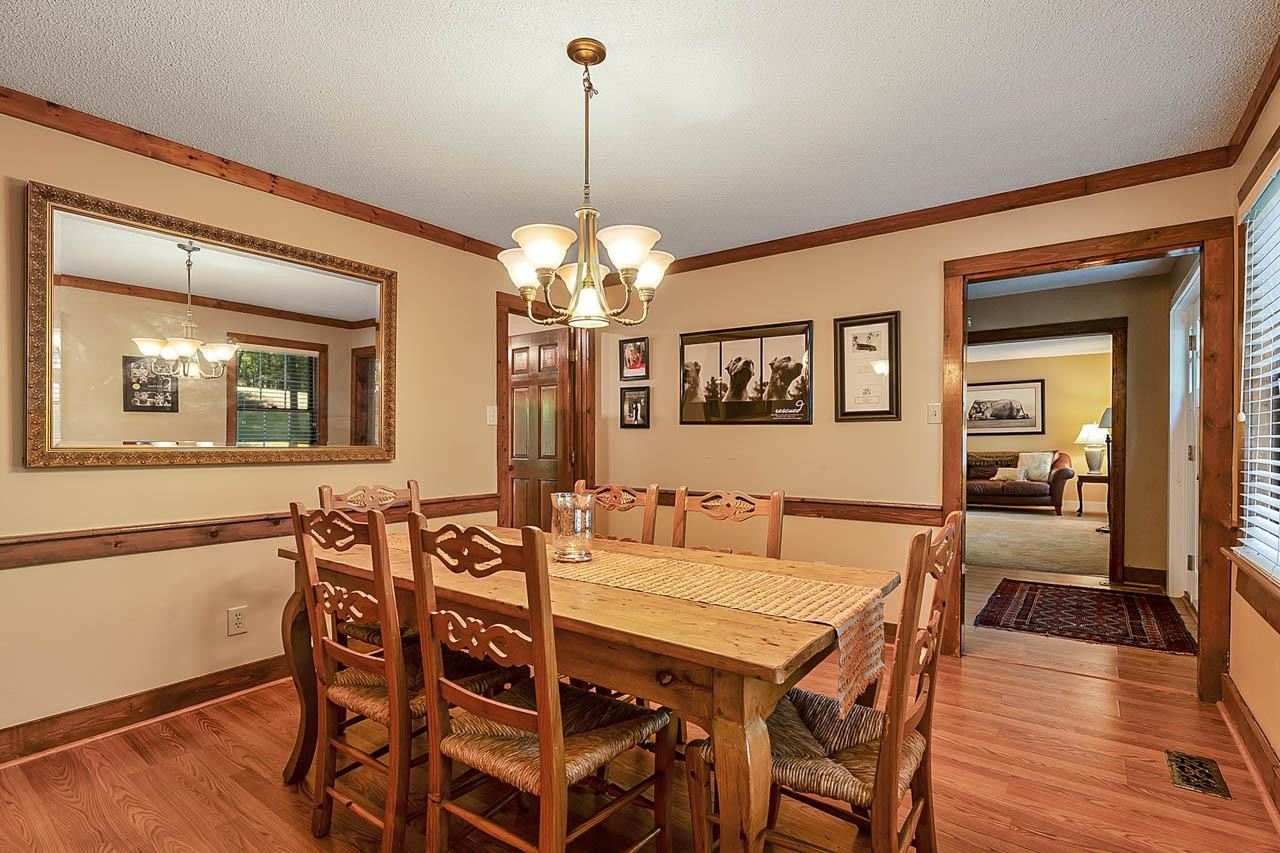 3109 Barnsley Lane Raleigh, NC 27604 - Photo 23 of 50 a view of a dining room with furniture and wooden floor