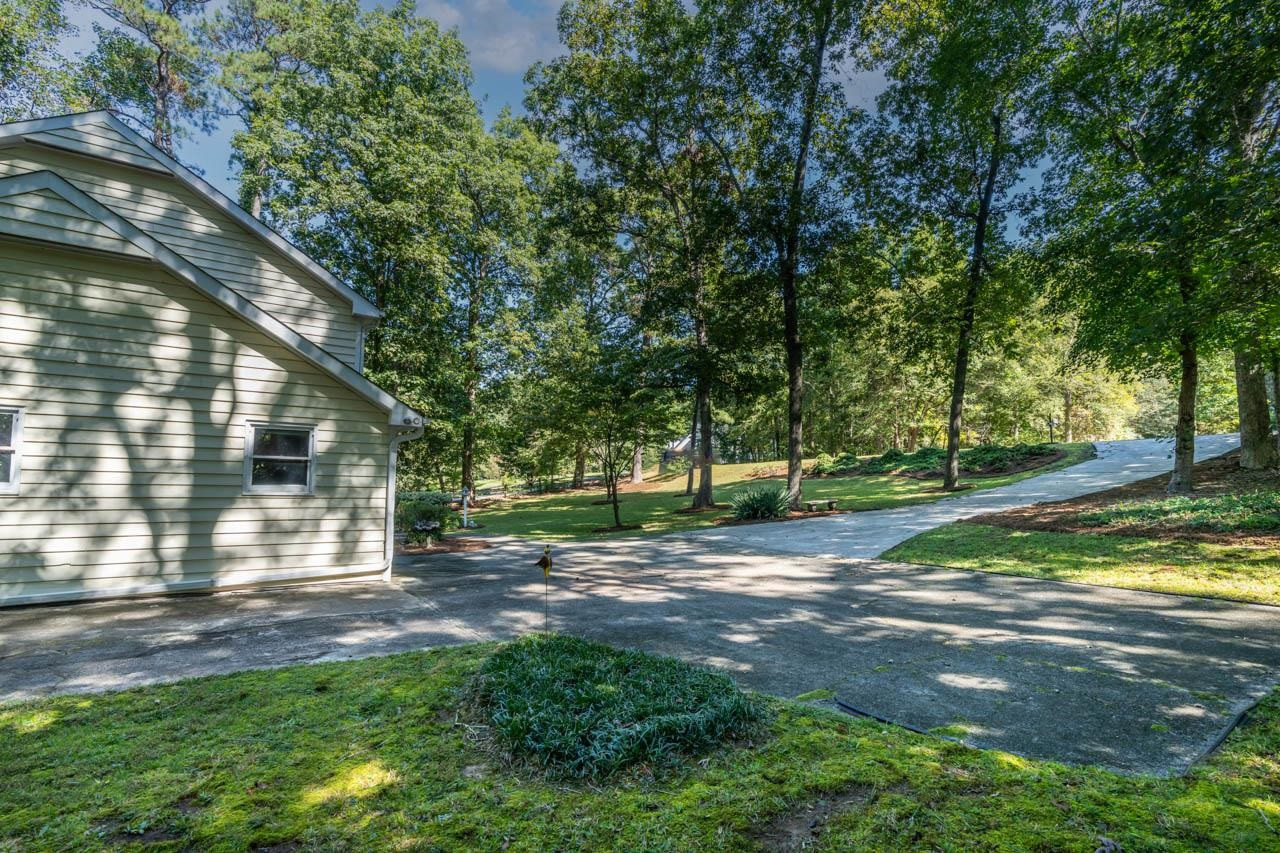 3109 Barnsley Lane Raleigh, NC 27604 - Photo 46 of 50 a view of a house with big yard and a large tree