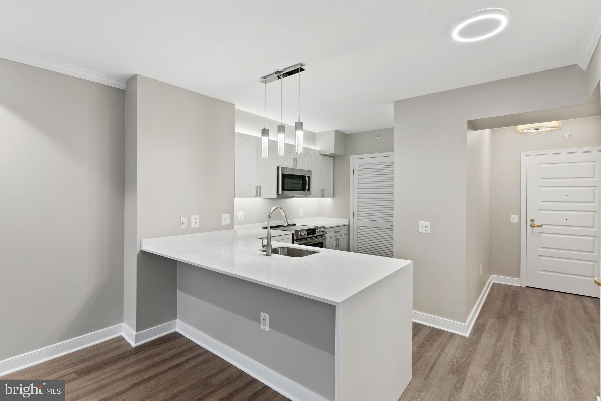 616 E Street Northwest, Unit 810 Washington, DC 20004 - Photo 6 of 15 a bathroom with a sink double vanity granite and a mirror