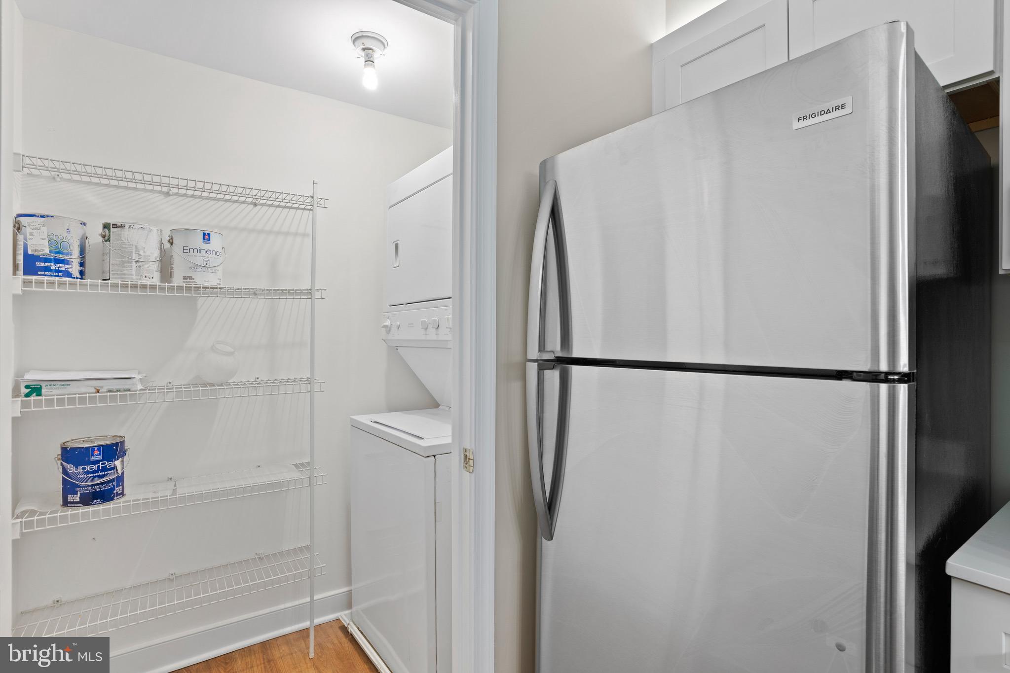 616 E Street Northwest, Unit 810 Washington, DC 20004 - Photo 7 of 15 a white refrigerator freezer and a refrigerator in a kitchen