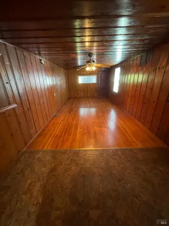 a view of room with wooden floor