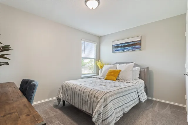 a view of walk in closet with clothes