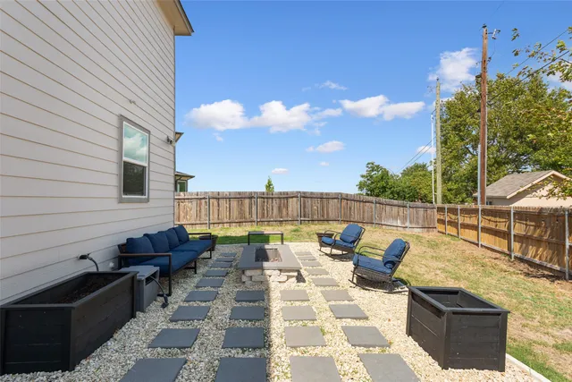 a room with a baby bed baby crib dresser and a window