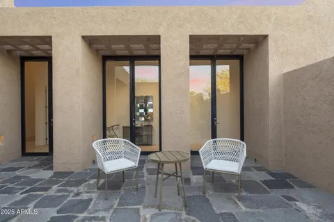 a living room with furniture and a lamp