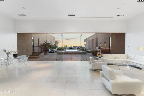 a view of a balcony dining table and chairs