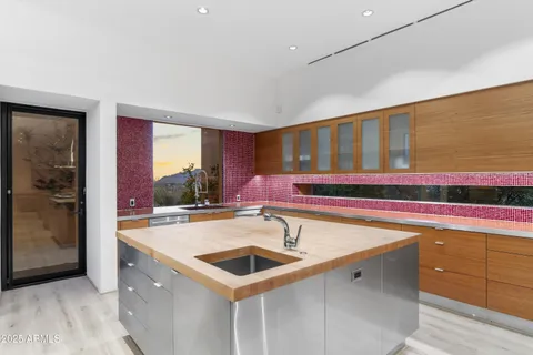 a view of a dining room with furniture and a potted plant