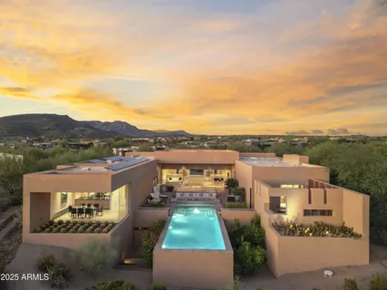 aerial view of a house with a yard