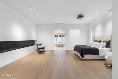 a view of swimming pool with outdoor seating and a city view