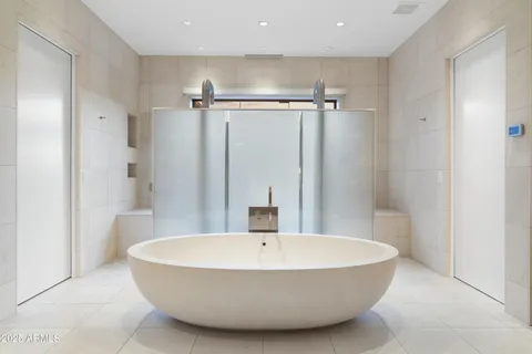 a view of a house with swimming pool and sitting area