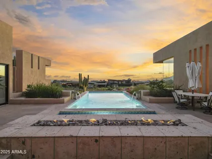 a view of a water fountain and a yard