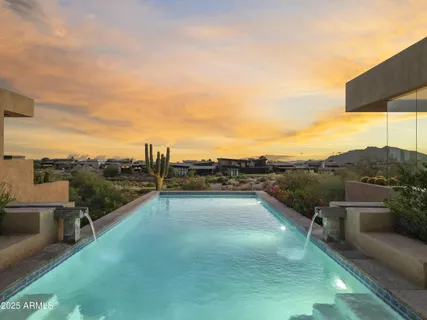 a view of swimming pool with outdoor seating