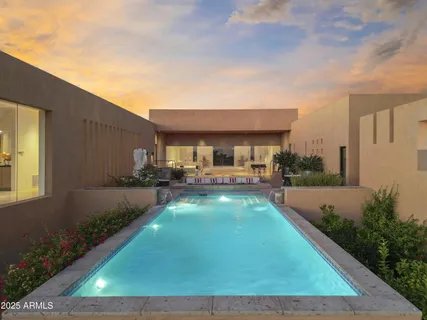 a view of a lake with couches and city view