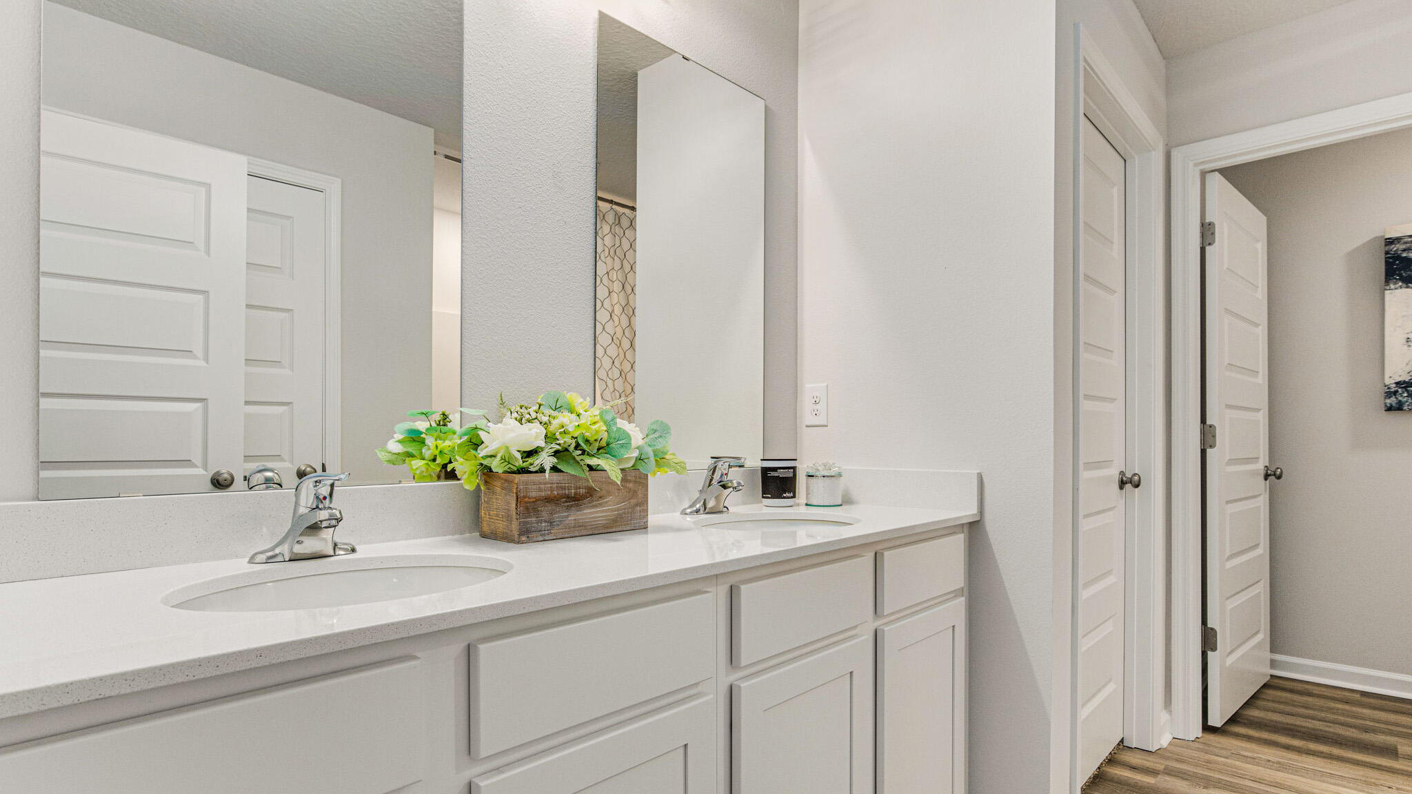2419 South Silver Street Crestview, FL 32536 - Photo 15 of 37 a bathroom with a sink a mirror and a potted plant
