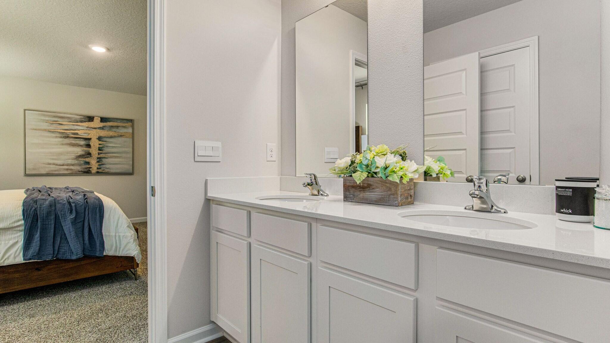 2419 South Silver Street Crestview, FL 32536 - Photo 16 of 37 a bathroom with a sink a vanity and a mirror