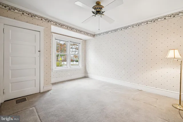 a view of an empty room with a window