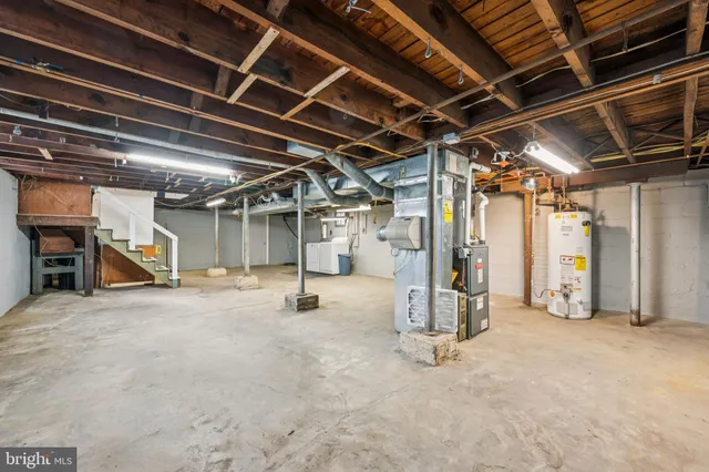 a view of empty room with wooden ceiling